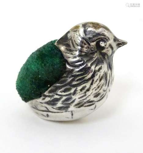 A small silver novelty pin cushion formed as a chick