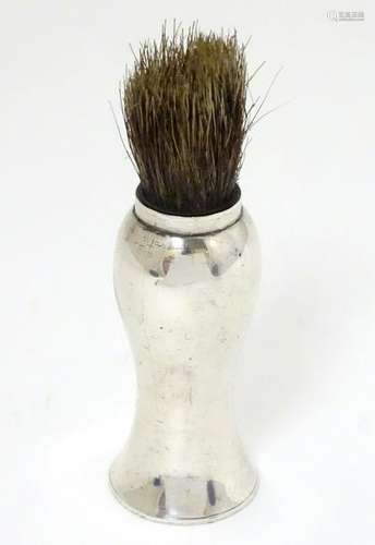 A silver handled shaving brush hallmarked Birmingham