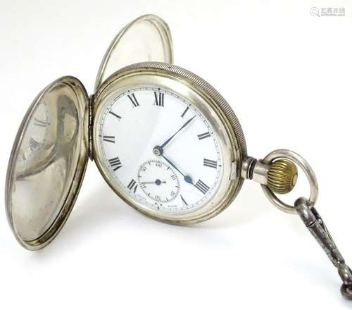 Pocket watch and chain: a hallmarked top wind Hunter