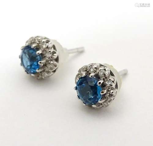 A pair of 18ct white gold stud earrings set with