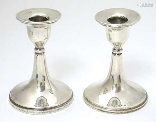 A pair of silver candlesticks hallmarked Birmingham