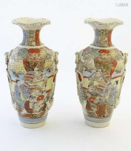 A pair of Japanese Satsuma vases, decorated with