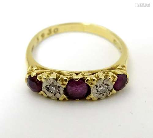 A late 20thC 18ct gold ring set with rubies and