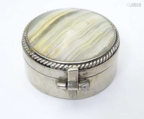 A silver plate box of circular form set with agate /