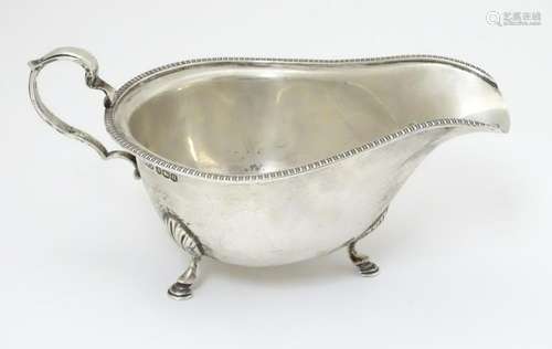 A silver sauce boat hallmarked Sheffield 1937 maker C W