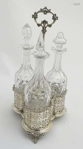 A 19thC silver plate three decanter set and stand, with