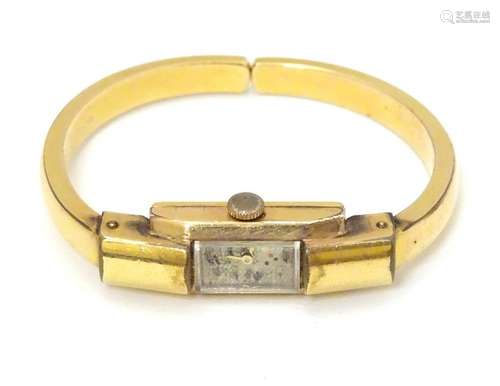 Le Phare: a rolled gold and gold plate bracelet watch