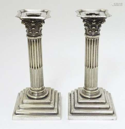 A pair of silver plate candlesticks  of Corinthian