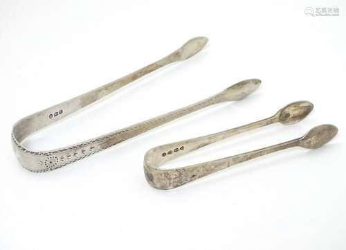 Geo III silver sugar tongs with bright cut decoration,