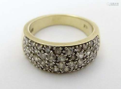 A 9ct gold ring set with pave set cubic zirconia