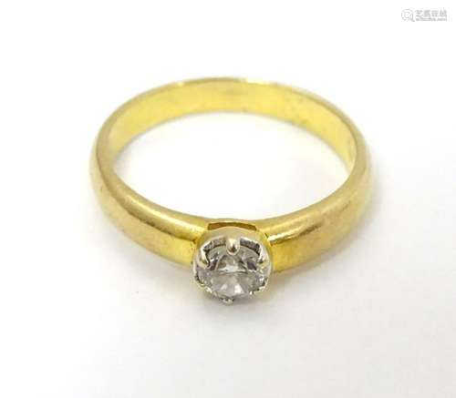 An 18ct gold diamond solitaire ring . Approx 0.5ct