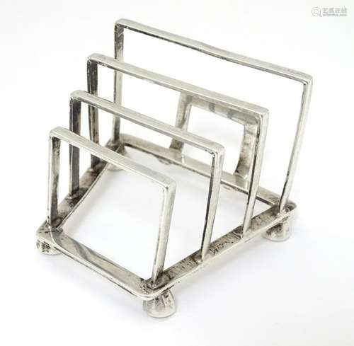 An Art Deco unusual silver 4-bar toast rack hallmarked