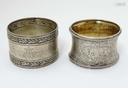 Two white metal napkin rings, one marked .900 silver