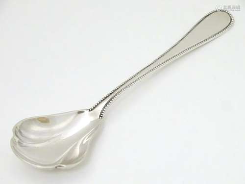 A German sterling silver preserve spoon marked Wilkens