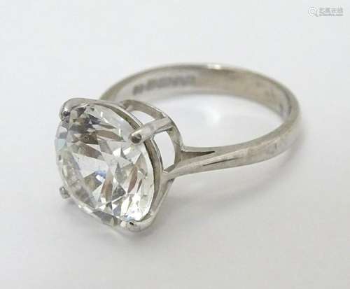 An 18ct white gold ring set with large white stone