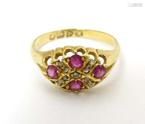 An 18ct gold ring set with spinel and diamonds