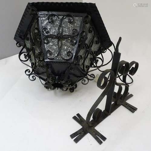 A wrought iron hexagonal pendant exterior lamp together