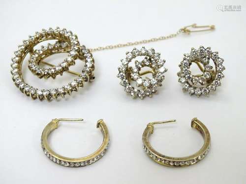 A silver gilt brooch set with white stones, together