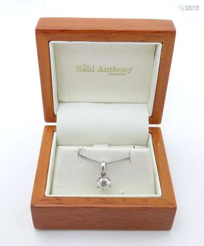 An 18ct white gold pendant set with brilliant cut