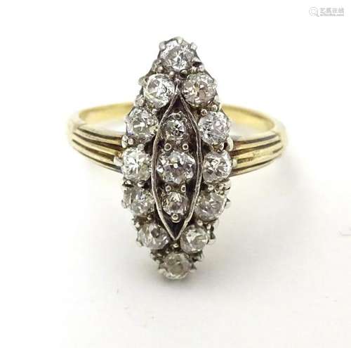 A Vintage 18ct gold ring set with 15 diamonds in a