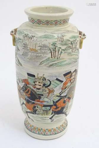 An Oriental satsuma vase with hand painted decoration