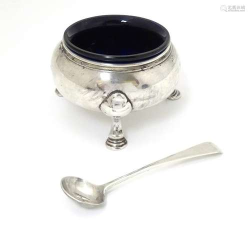 An 18thC / 19thC silver table salt of circular form