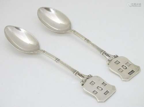 A pair of silver teaspoons with shield cartouche to