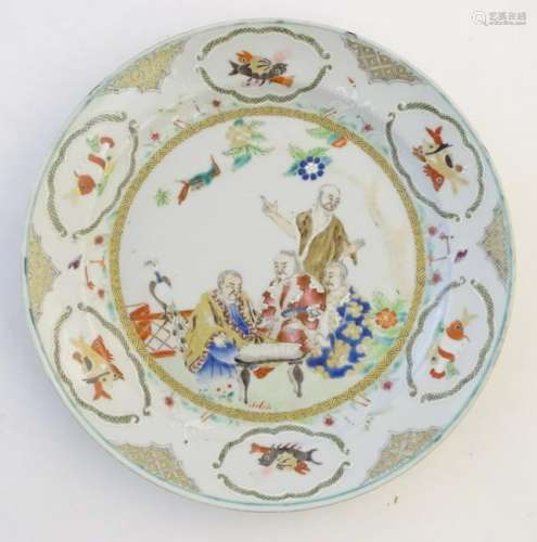 A Chinese famille verte plate with gilt highlights,