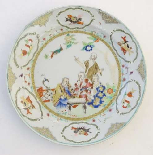 A Chinese famille verte plate with gilt highlights,
