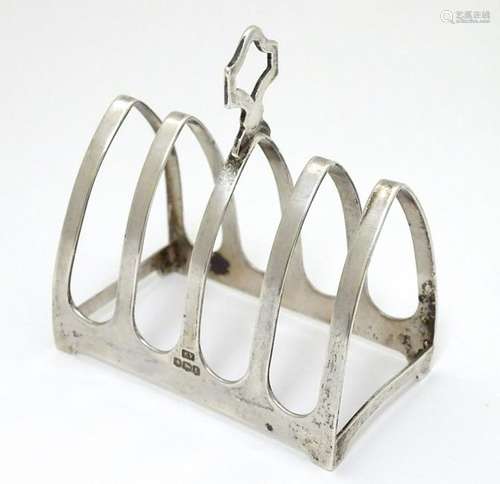 A silver 5-bar toast rack hallmarked Sheffield 1936