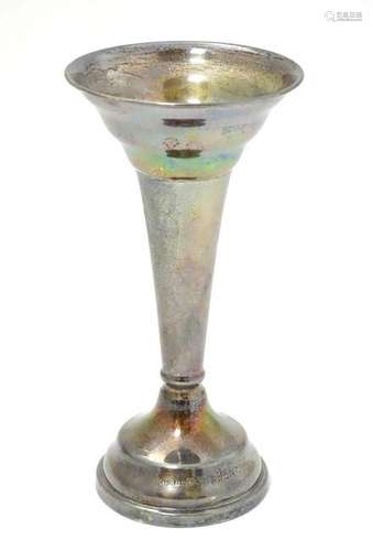 A silver bud vase of trumpet form hallmarked Birmingham