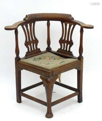 A late Georgian corner chair with turned supports,