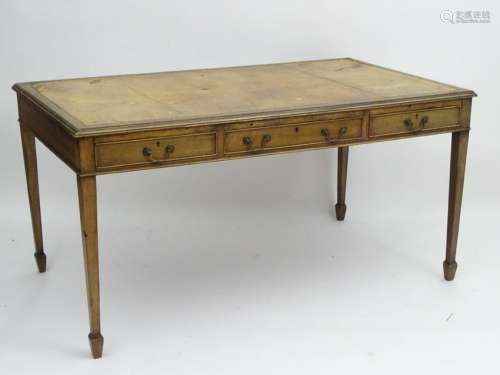 An early 20thC mahogany writing desk with an inset