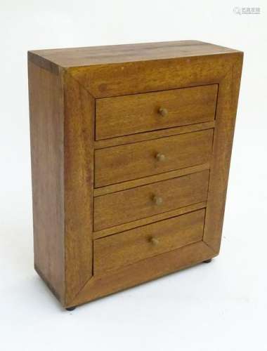 A small 20thC mahogany chest of drawers, comprising