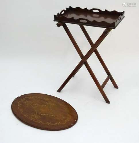 A 19thC mahogany butlers tray with an associated stand