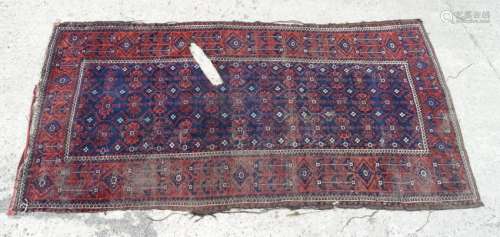 Carpet rug: An old handmade Persian rug having a dark
