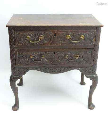 An early 18thC oak lowboy, with later Victorian carving