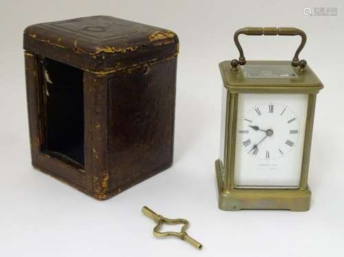 Carriage clock and case: a JD brass, 5 bevelled glass