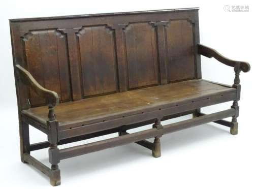 A 17thC and later oak settle with a moulded top rail