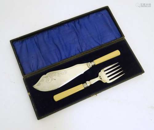 A cased set of silver plate and ivorine fish servers,