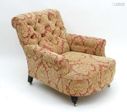 A late 19thC Howard style armchair with button back