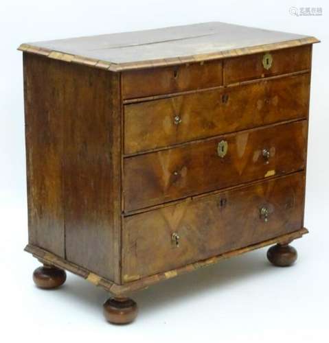 A Queen Anne walnut chest of drawers, comprising two