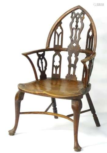 An 18thC yew and ash Gothic Windsor chair, with a