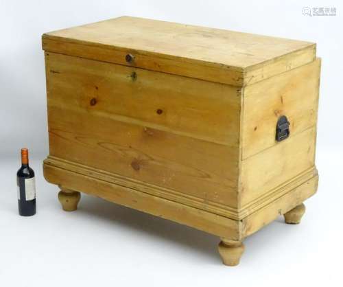 A late 19thC pine cellarette with a double lifting lid