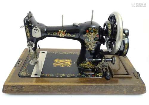 Sewing machine: a hand painted on gold transfer, hand