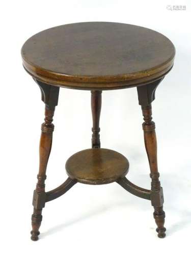 A late 19thC mahogany occasional table with a circular
