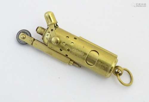 A 21stC Trench-type cigarette lighter, of brass