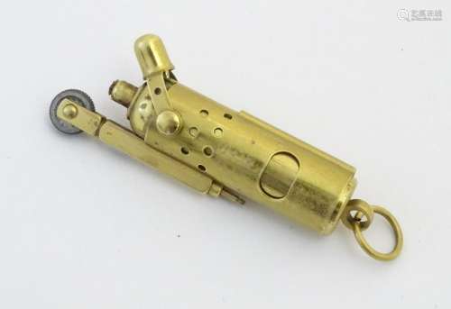 A 21stC Trench-type cigarette lighter, of brass