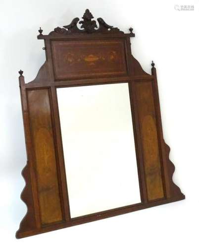 A late 19thC / early 20thC mahogany mirror with carved