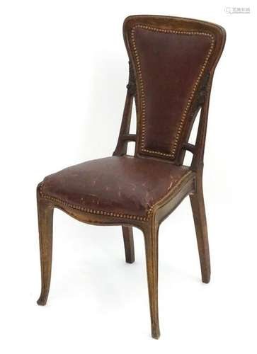 An Art Nouveau continental walnut dining chair with